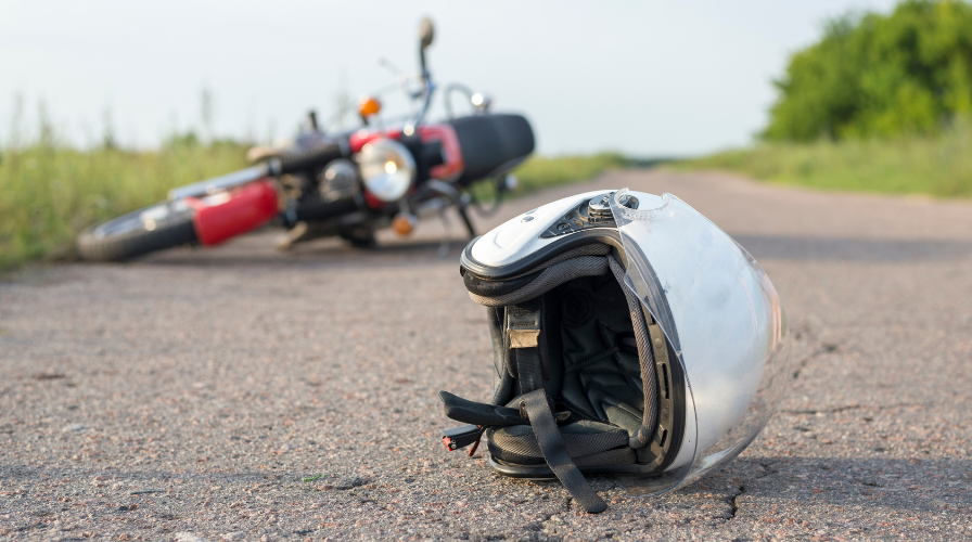 Motorcycle helmet on pavement, Motorcycle Accident Lawyers Atlanta GA, Issa Castro Law Firm.