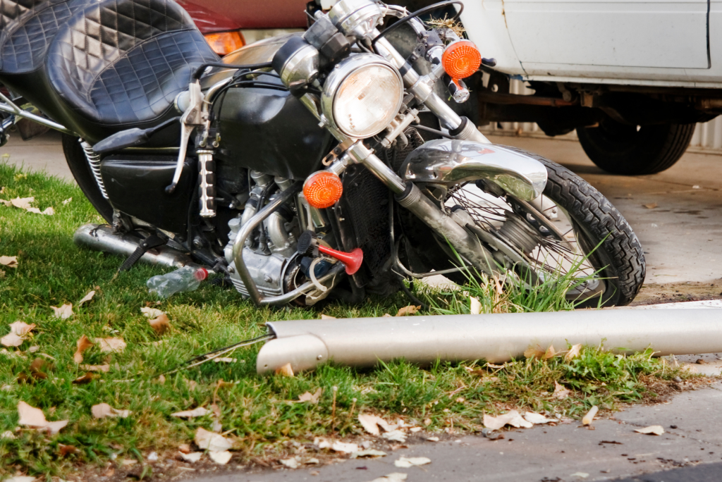 Motorcycle crash Image of a motorcycle on the road that has been wrecked, Issa Castro Law Firm.