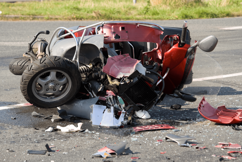 Damaged Motorcycle Image of a motorcycle on the road that has been wrecked, Issa Castro Law Firm.
