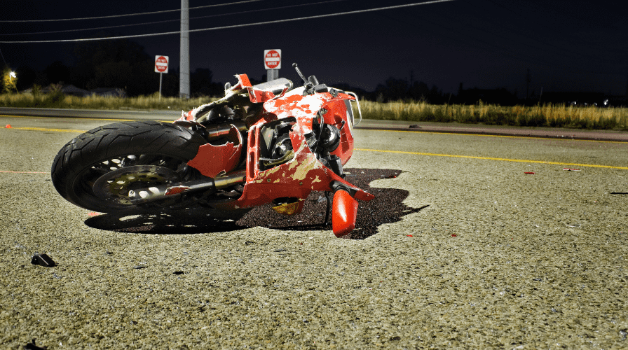 Image of a motorcycle on the road that has been wrecked, Issa Castro Law Firm.