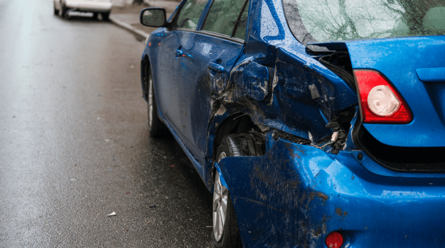 Damaged Car Image of a car that was broad sided, settlement for tractor trailer collision, Issa Castro Law Firm.