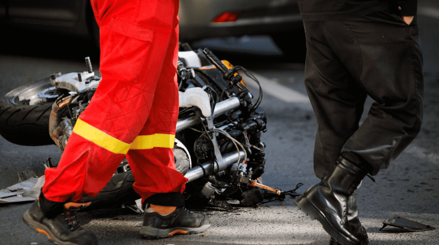motorcycle crash Image of a motorcycle on the road that has been wrecked, Issa Castro Law Firm.