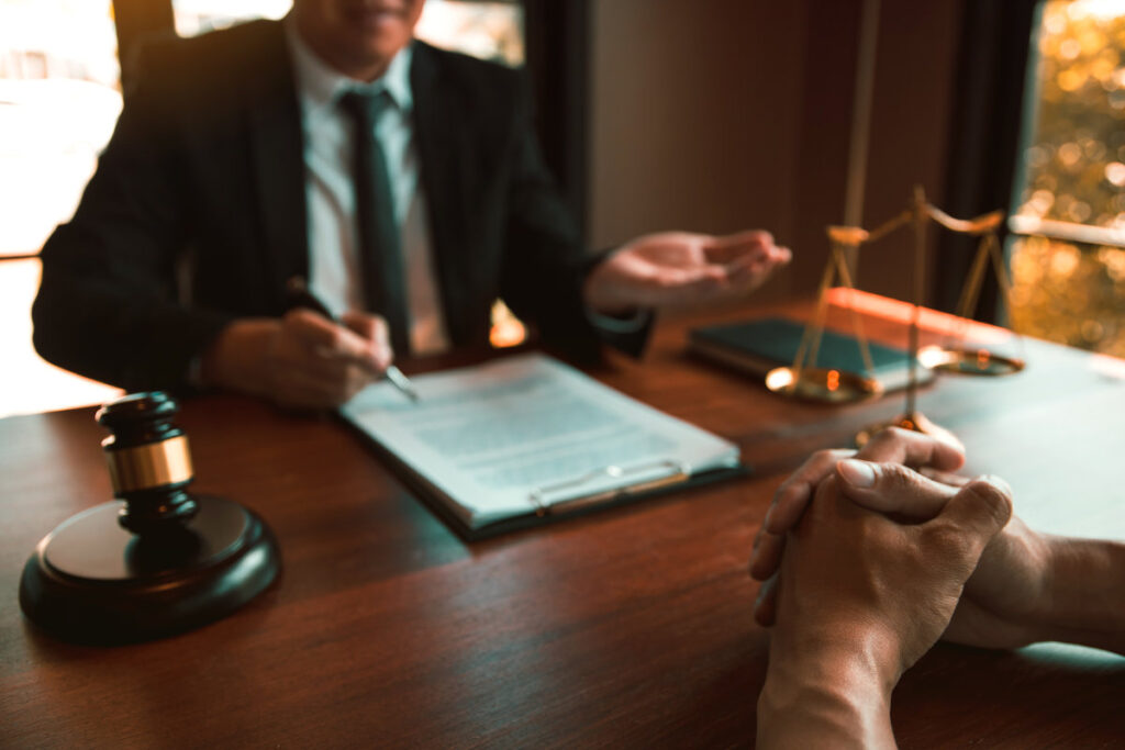 Lawyer is providing information about the client's trial at the lawyer office.