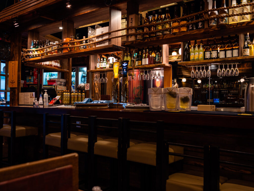 SINGAPORE – JULY 08 – Empty bar counter at The Public Izakaya Japanese restaurant in Tanjong Pagar, Singapore in the evening. Business has been slow due to covid-19 / coronavirus